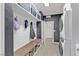 Functional mudroom with built-in bench, storage shelves, and access to laundry at 10729 Marathon Bell Ln, Las Vegas, NV 89129