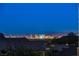 Stunning Las Vegas Strip views from this home, highlighting the city's vibrant nightscape and distant mountains at 10729 Marathon Bell Ln, Las Vegas, NV 89129