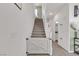 Bright staircase features a white baby gate and leads to the upper level at 10729 Marathon Bell Ln, Las Vegas, NV 89129