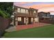 Spacious backyard with a covered patio and artificial grass at 11707 Longworth Rd, Las Vegas, NV 89135