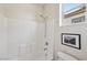Clean bathroom featuring a shower-tub combo, complemented by neutral walls and fixtures at 11707 Longworth Rd, Las Vegas, NV 89135