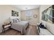 This bedroom offers a cozy feel with wood floors, modern accents, and ample natural light at 11707 Longworth Rd, Las Vegas, NV 89135