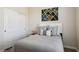 Comfortable bedroom featuring a neutral palette, stylish decor, and a mirrored closet at 11707 Longworth Rd, Las Vegas, NV 89135