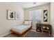 Inviting bedroom with a twin platform bed, natural light, and a minimalist desk area at 11707 Longworth Rd, Las Vegas, NV 89135