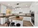 Bright kitchen features white cabinetry, stainless steel appliances, granite countertops, and a spacious center island at 11707 Longworth Rd, Las Vegas, NV 89135