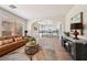 Comfortable living room with view of open concept kitchen and hardwood floors for a warm welcome at 11707 Longworth Rd, Las Vegas, NV 89135