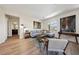 Stylish living room with modern decor, wood floors, and plenty of natural light at 11707 Longworth Rd, Las Vegas, NV 89135