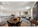 Inviting loft features flexible seating, an open layout, wood flooring, and stylish decor at 11707 Longworth Rd, Las Vegas, NV 89135