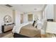 Relaxing main bedroom features a comfortable bed, stylish decor, and plenty of natural light at 11707 Longworth Rd, Las Vegas, NV 89135