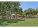 Community playground with shaded seating, offering a relaxed and Gathering-friendly atmosphere at 11707 Longworth Rd, Las Vegas, NV 89135