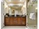 Bathroom boasts dual vanity, walk-in shower, and a decorative mirror at 125 E Harmon Ave # 717, Las Vegas, NV 89109