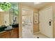 Hotel bathroom with a glass-enclosed shower and a tub, seen from the entrance of the suite at 125 E Harmon Ave # 717, Las Vegas, NV 89109