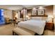 Comfortable hotel suite bedroom featuring a king bed, lounge seating, and tasteful decor at 125 E Harmon Ave # 717, Las Vegas, NV 89109