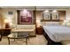 Cozy bedroom features a comfortable bed, neutral tones, couch, and decorative artwork at 125 E Harmon Ave # 717, Las Vegas, NV 89109