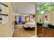Comfortable hotel suite bedroom featuring a king bed, lounge seating, and a stylish wet bar at 125 E Harmon Ave # 717, Las Vegas, NV 89109