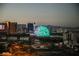 The Las Vegas skyline displays the illuminated MSG Sphere with turquoise and white accents at dusk at 125 E Harmon Ave # 717, Las Vegas, NV 89109