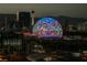 The Las Vegas skyline showcases the illuminated MSG Sphere at dusk featuring various flag displays at 125 E Harmon Ave # 717, Las Vegas, NV 89109
