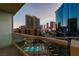 Breathtaking city views from the balcony featuring a sparkling pool and distant mountains at 125 E Harmon Ave # 717, Las Vegas, NV 89109