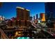 Enjoy city views from this condo's balcony showcasing a swimming pool at 125 E Harmon Ave # 717, Las Vegas, NV 89109