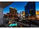 Enjoy city views from this condo's balcony showcasing a swimming pool at 125 E Harmon Ave # 717, Las Vegas, NV 89109