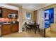 Well-equipped kitchenette with dark countertops, modern appliances, and adjacent dining area with city views at 125 E Harmon Ave # 717, Las Vegas, NV 89109