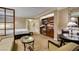 Comfortable living room with dining area, sofa, chairs and kitchenette area with stainless steel appliances at 125 E Harmon Ave # 717, Las Vegas, NV 89109