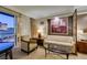 Inviting living room with neutral tones, comfortable seating, and city views from the balcony at 125 E Harmon Ave # 717, Las Vegas, NV 89109