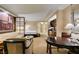 Open-concept living area showcasing a cozy seating area, breakfast table and kitchenette with stainless steel appliances at 125 E Harmon Ave # 717, Las Vegas, NV 89109