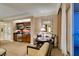 Living room with dining area, chairs, and kitchenette area with stainless steel appliances next to sliding glass doors at 125 E Harmon Ave # 717, Las Vegas, NV 89109