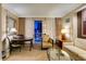 Open-concept living space with a comfortable seating area and city views through large windows at 125 E Harmon Ave # 717, Las Vegas, NV 89109