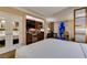 Hotel suite featuring an open bedroom area, a full wet bar, and mirrored closet doors at 125 E Harmon Ave # 717, Las Vegas, NV 89109