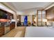 Hotel suite featuring a full wet bar, comfortable seating area, and an open bedroom area at 125 E Harmon Ave # 717, Las Vegas, NV 89109