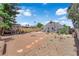 Large backyard featuring mature trees, fire pit, outdoor seating, and sparkling pool at 1320 Wengert Ave, Las Vegas, NV 89104