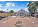 Spacious backyard features a fire pit, outdoor seating, and sparkling pool at 1320 Wengert Ave, Las Vegas, NV 89104
