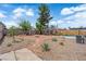 Spacious backyard features a fire pit, mature trees, and ample space for outdoor activities at 1320 Wengert Ave, Las Vegas, NV 89104