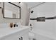 Updated bathroom with white subway tile, black and white accent, floating vanity, and shower at 1320 Wengert Ave, Las Vegas, NV 89104