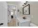 Bright bathroom features a modern vanity with white countertop and sleek black fixtures at 1320 Wengert Ave, Las Vegas, NV 89104