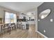 Dining area featuring an open kitchen, island seating, and ample natural light at 1320 Wengert Ave, Las Vegas, NV 89104
