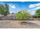 Charming single story home with gray exterior, brick detail, drought landscaping, and mature tree at 1320 Wengert Ave, Las Vegas, NV 89104