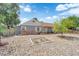 Charming single story home with gray exterior, brick detail, drought landscaping, and mature tree at 1320 Wengert Ave, Las Vegas, NV 89104