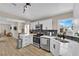 Bright kitchen featuring white cabinets, stainless steel appliances, and a modern backsplash at 1320 Wengert Ave, Las Vegas, NV 89104