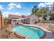Backyard pool with a small, well-maintained yard, with a shade cover over the shallow end at 1320 Wengert Ave, Las Vegas, NV 89104