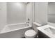 Bright bathroom featuring a white subway tile shower and white toilet and vanity at 148 Campbelltown Ave, Henderson, NV 89015