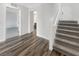 Entryway features sleek wood floors, a staircase to the second floor, and white walls at 148 Campbelltown Ave, Henderson, NV 89015