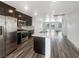 Modern kitchen featuring an island with stainless steel appliances and dark wood cabinets at 148 Campbelltown Ave, Henderson, NV 89015