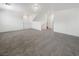 Large living room space with neutral carpet, white walls, and modern recessed lighting at 148 Campbelltown Ave, Henderson, NV 89015