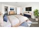 A bright and airy main bedroom featuring modern decor and a walk-in closet at 148 Campbelltown Ave, Henderson, NV 89015