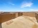 Spacious roof deck with perimeter walls offering privacy and city views in the distance at 148 Campbelltown Ave, Henderson, NV 89015