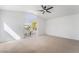 Bright bedroom with sliding door and balcony access, and neutral colored carpet at 1553 Ravanusa Dr, Henderson, NV 89052