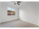 Bright bedroom featuring a modern ceiling fan and a sunlit view from the window at 1553 Ravanusa Dr, Henderson, NV 89052